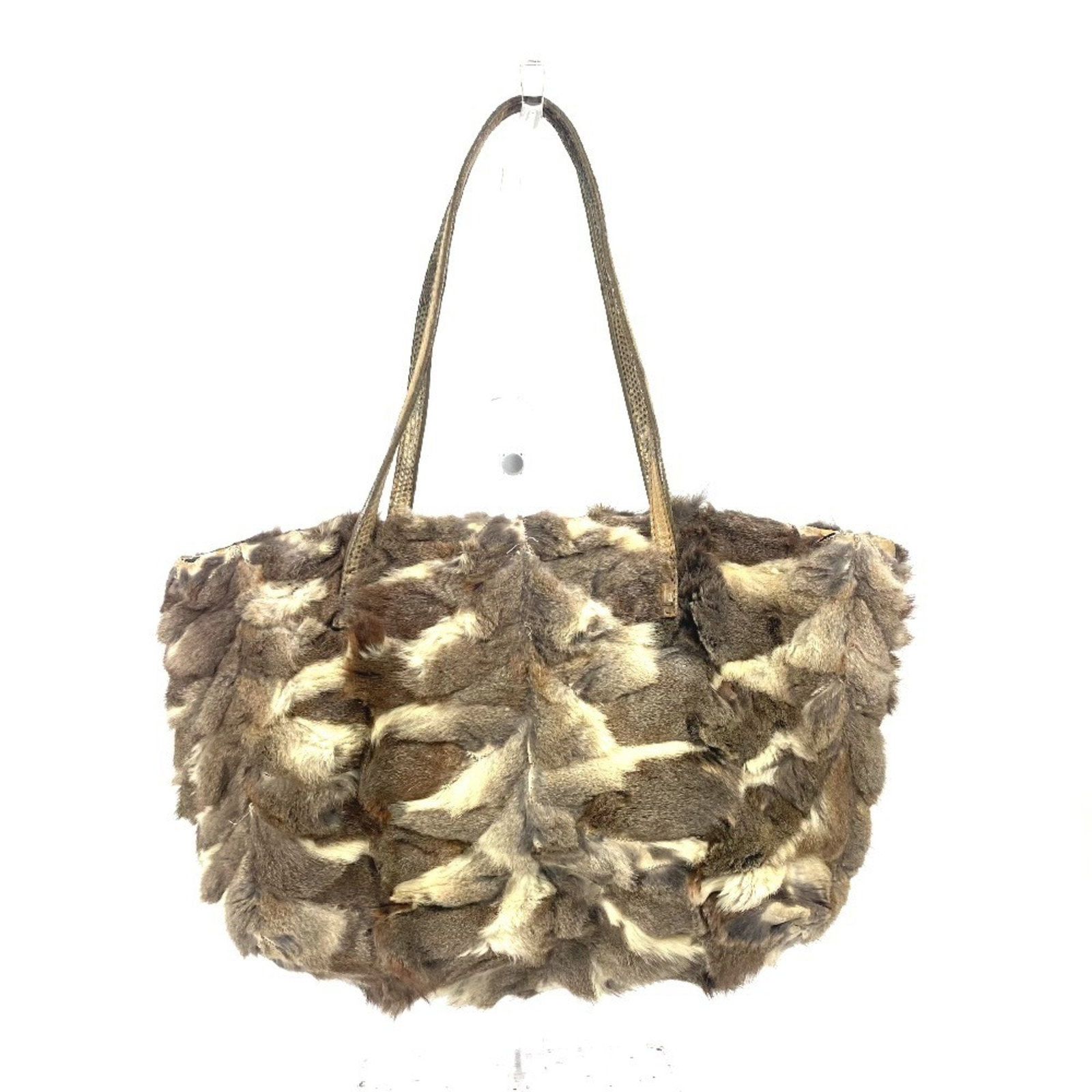 Fendi Beige Fur Tote Handbag for Women 17cm x 30cm x 8cm: Fendi Beige Fur Tote Handbag for Women 17cm x 30cm x 8cm This elegant Fendi handbag, crafted from luxurious fur in a sophisticated beige color, is perfect for the modern woman. With a versatile tote d