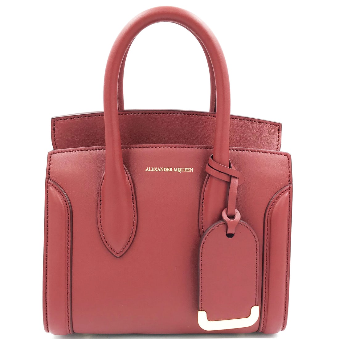 Alexander McQueen Heroine 21 Dark Red Leather Satchel with Adjustable Strap: Alexander McQueen Heroine 21 Dark Red Leather Satchel with Adjustable Strap This Alexander McQueen Heroine 21 satchel is a stunning accessory for any fashion-forward individual. Crafted from high-qual