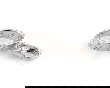 Cartier Love 7 Diamond 18k White Gold Charm with Original Paper: Cartier Love 7 Diamond 18k White Gold Charm with Original Paper Enhance your jewelry collection with this exquisite Cartier Love 7 Diamond Mini Ring Charm, meticulously crafted in 18k white gold. This