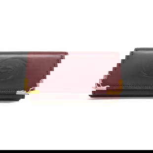 Cartier Must L3000453 Bordeaux Leather Key Case for Women: Cartier Must L3000453 Bordeaux Leather Key Case for Women Introducing the Cartier Must L3000453 Women's Leather Key Case in a rich Bordeaux color. This elegant key case features a secure snap closure