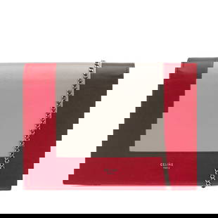 Celine Frame Leather Wallet on Chain Red with Silver Strap: Celine Frame Leather Wallet on Chain Red with Silver Strap The Celine Frame Leather Wallet on Chain is a sophisticated accessory crafted from premium leather. It features a striking red exterior compl