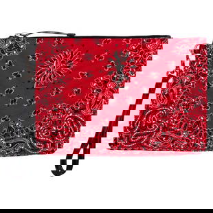 Yves Saint Laurent Red Bandana Clutch with Wristlet: Yves Saint Laurent Red Bandana Clutch with Wristlet This stunning Yves Saint Laurent clutch features a vibrant bandana pattern quilted in red, white, and black, making it a standout accessory. Crafted