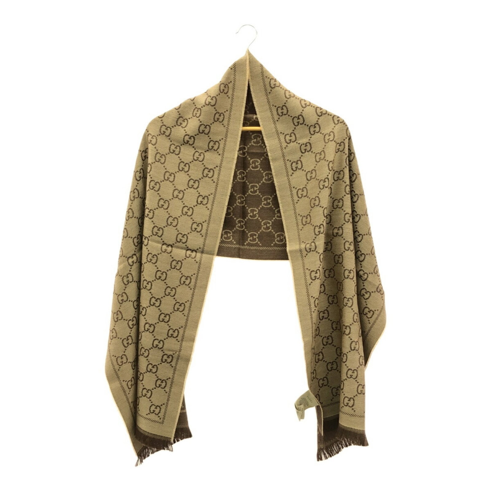 Gucci GG Pattern Wool Stole 133483 Brown Luxury Accessory: Gucci GG Pattern Wool Stole 133483 Brown Luxury Accessory Elevate your accessory game with this luxurious Gucci scarf, featuring a classic GG pattern. Made from 100% premium wool, this stole is design