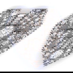 Vintage French Art Deco Platinum Diamond Brooch 1.5 inches 7.90 Ct Total: Vintage French Art Deco Platinum Diamond Brooch 1.5 inches 7.90 Ct Total This exquisite French Art Deco Platinum Diamond Brooch features a stunning design, weighing 14.9 grams. The centerpiece is an a