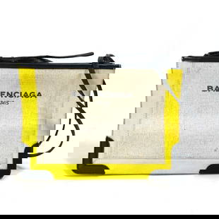 Balenciaga 339937 Yellow Leather Crossbody Shoulder Bag 25cm x 18.5cm: Balenciaga 339937 Yellow Leather Crossbody Shoulder Bag 25cm x 18.5cm This stylish Balenciaga crossbody clutch bag combines a chic design with practical functionality. Crafted from high-quality leathe