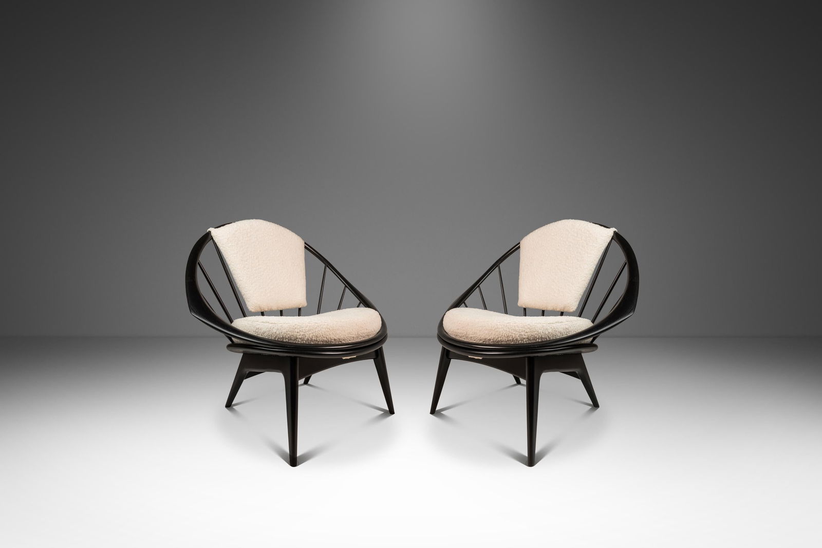 Pair of Ib Kofod-Larsen Danish Modern Ebonized Boucle Chairs: Pair of Ib Kofod-Larsen Danish Modern Ebonized Boucle Chairs Discover a stunning set of two Danish Mid-Century Modern "Hoop" or "Peacock" chairs, designed by the renowned Ib Kofod-Larsen for Selig in
