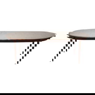 Mid-Century Modern Rosewood Oval Dining Table 58.75 x 40 x 28.25 with 2 Leaves: Mid-Century Modern Rosewood Oval Dining Table 58.75 x 40 x 28.25 with 2 Leaves This exquisite mid-century modern oval dining table is crafted from beautifully selected Brazilian rosewood, showcasing s