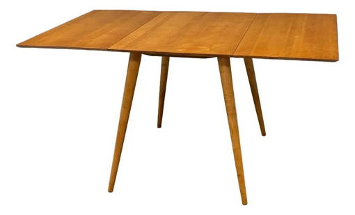 Mid-Century Modern Paul McCobb Drop Leaf Dining Table Maple 1950s: Mid-Century Modern Paul McCobb Drop Leaf Dining Table Maple 1950s This elegant mid-century modern dining table, designed by Paul McCobb for Winchendon's Planner Group, showcases a refined drop leaf de