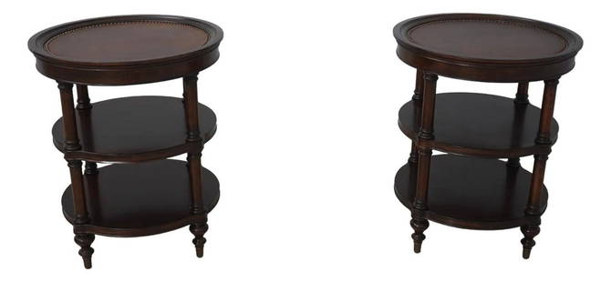 Pair of Brown Round Leather Top Occasional Tables with Brass Feet: Pair of Brown Round Leather Top Occasional Tables with Brass Feet This is a pair of occasional tables featuring a round leather top with a distressed finish. The tables boast studded leather tops and