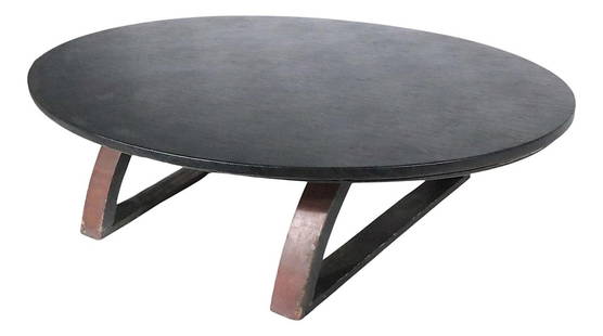 Mid Century Folky Modernist Oval Coffee Table Black Vinyl Top: Mid Century Folky Modernist Oval Coffee Table Black Vinyl Top This stylish architectural mid-century coffee table features a striking oval top, elegantly covered in vinyl, and is supported by a unique
