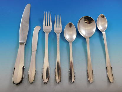 Georg Jensen Beaded Sterling Silver Flatware Set for 8 56 pcs: Georg Jensen Beaded Sterling Silver Flatware Set for 8 56 pcs Elevate your dining experience with this exquisite Beaded Sterling Silver Flatware Set by Georg Jensen, designed in 1916. This 56-piece se