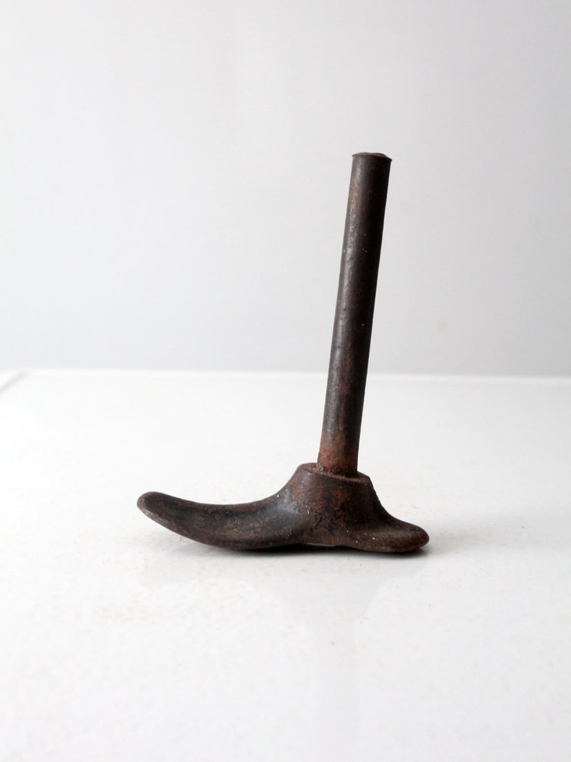 19th Century Antique Cast Iron Cobbler Shoe Form 6.75" Unique Decor: 19th Century Antique Cast Iron Cobbler Shoe Form 6.75" Unique Decor This 19th century antique cast iron cobbler shoe form showcases a blend of historical charm and rustic appeal. Its sturdy constructi