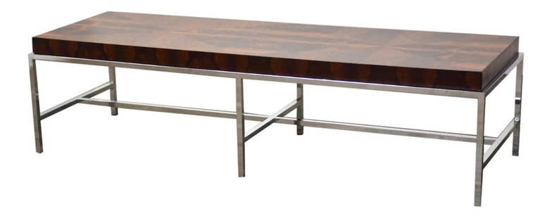 Mid-Century Modern Rosewood Coffee Table Chrome Base 63.5": Mid-Century Modern Rosewood Coffee Table Chrome Base 63.5" Discover the elegance of mid-century modern design with this stunning rosewood coffee table featuring a polished chrome base, reminiscent of