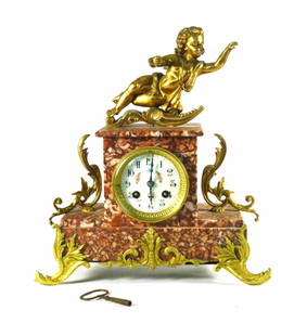 Classic Marble Mantle Clock with Cherub 13x12x4.75 inches: Classic Marble Mantle Clock with Cherub 13x12x4.75 inches Presenting a stunning Marble Mantle Clock featuring a large cherub atop its elegant design. This original piece showcases a beautiful red marb