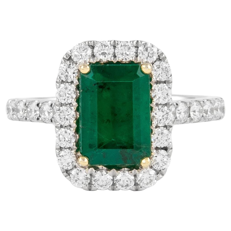 GIA 2.35ct Emerald Cut Emerald and Diamond Halo Ring 18k Gold: GIA 2.35ct Emerald Cut Emerald and Diamond Halo Ring 18k Gold This stunning GIA-certified halo ring features a contemporary design, showcasing a vibrant 1.63 carat emerald cut emerald at its center, s