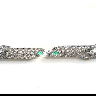 Vintage Art Deco Platinum Diamond Emerald Brooch 1.25 Ct Diamond 4.50 Ct Diamonds: Vintage Art Deco Platinum Diamond Emerald Brooch 1.25 Ct Diamond 4.50 Ct Diamonds This exquisite Art Deco brooch is crafted from platinum and features a stunning arrangement of diamonds and emeralds.