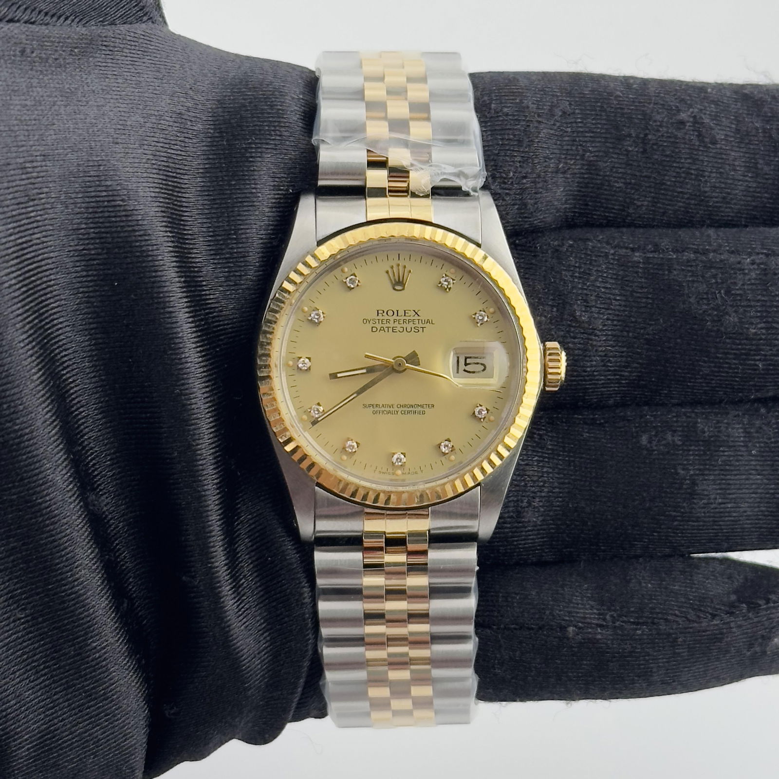 Rolex Datejust 16013 Champagne Diamond Dial AM Jubilee Bracelet: Rolex Datejust 16013 Champagne Diamond Dial AM Jubilee Bracelet This exquisite Rolex Datejust features a stunning champagne diamond dial that adds a touch of elegance. Designed for men, this watch is