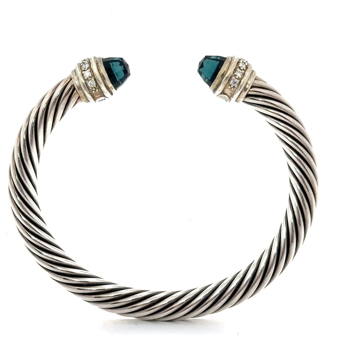David Yurman Sterling Silver Blue Topaz Diamond Cable Cuff Bracelet: David Yurman Sterling Silver Blue Topaz Diamond Cable Cuff Bracelet This exquisite David Yurman cuff bracelet features a stunning natural blue topaz at its center, complemented by sparkling diamonds. 