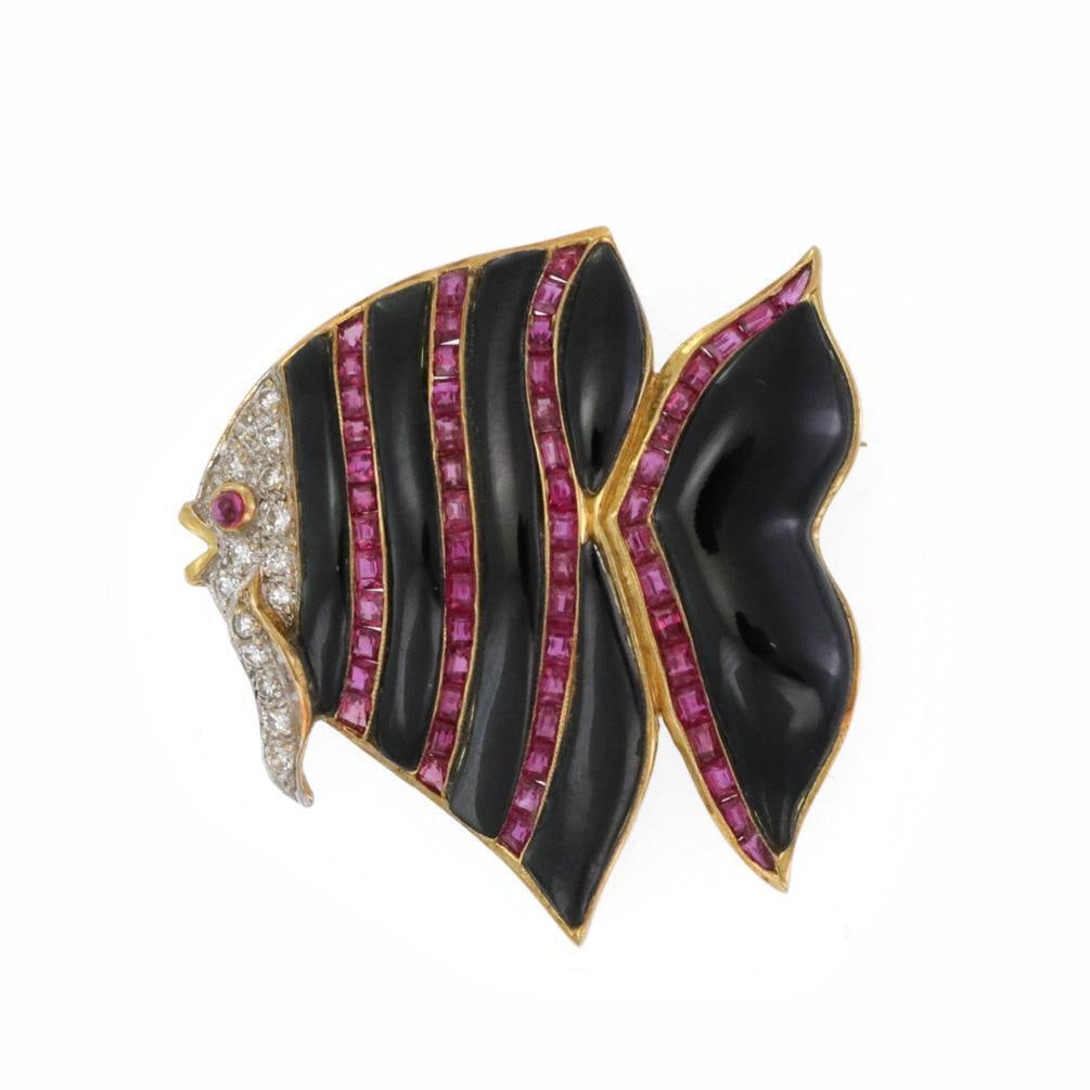 Elegant 18k Gold Fish Brooch with Onyx Ruby and Diamond Accents: Elegant 18k Gold Fish Brooch with Onyx Ruby and Diamond Accents This exquisite brooch features a delightful fish design, meticulously crafted from 18k yellow gold with white gold accents. The body of