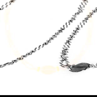 David Yurman 18k Gold Smoky Quartz Pendant with Sterling Silver Chain: David Yurman 18k Gold Smoky Quartz Pendant with Sterling Silver Chain This exquisite pendant and chain by David Yurman features a stunning long briolette cut smoky quartz bead, elegantly capped with 1