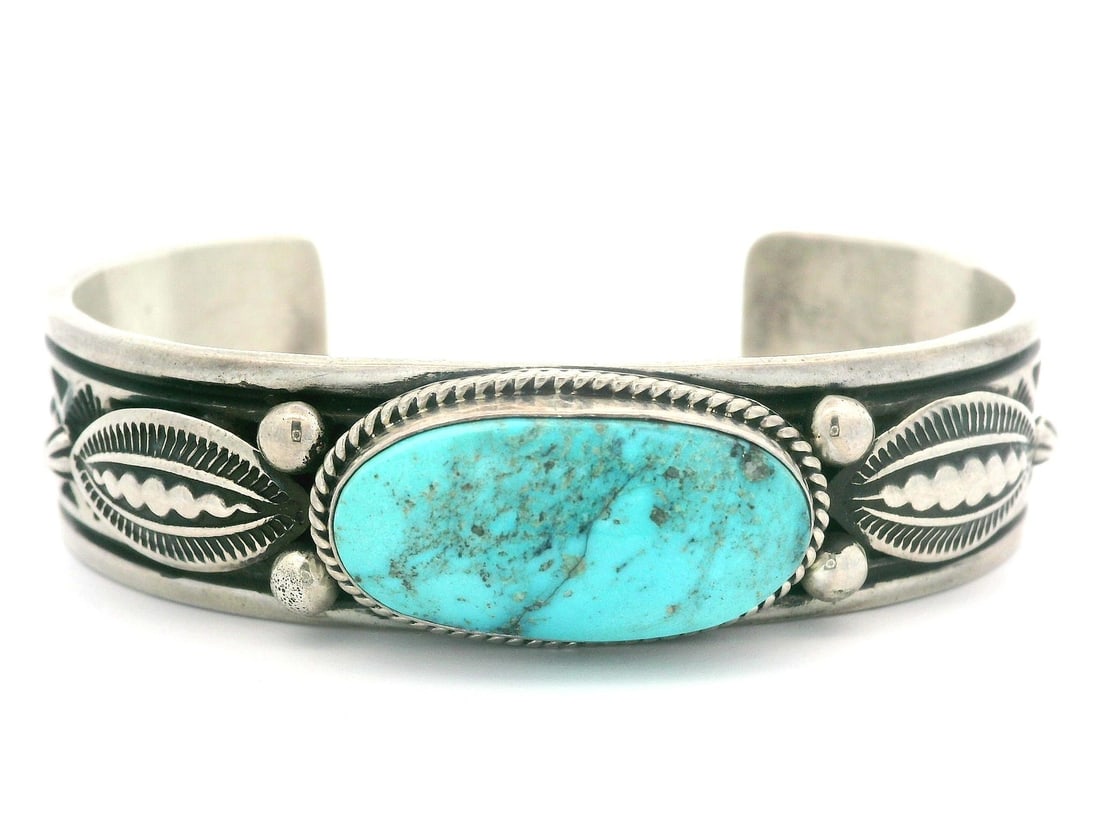 Navajo Happy Piasso Sterling Silver Turquoise Cuff Bangle Bracelet: Navajo Happy Piasso Sterling Silver Turquoise Cuff Bangle Bracelet This exquisite Navajo Happy Piasso cuff bangle bracelet showcases a stunning oval turquoise stone in a vibrant blue hue, beautifully 