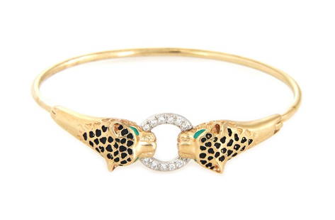 Vintage 14k Gold Panther Head Bracelet with Diamond Door Knocker: Vintage 14k Gold Panther Head Bracelet with Diamond Door Knocker This exquisite vintage bangle bracelet is made of 14k yellow gold and features a unique door knocker design with double panther heads.