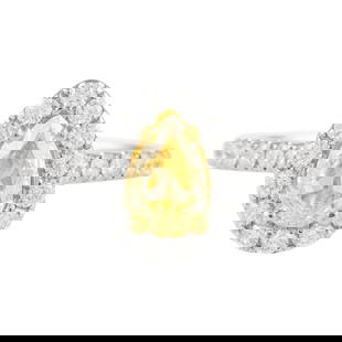 GIA 1ct Pear Fancy Yellow Diamond Halo Ring 18k White Gold: GIA 1ct Pear Fancy Yellow Diamond Halo Ring 18k White Gold This exquisite ring features a stunning 1.00 carat pear cut Fancy Yellow diamond graded VS1 by GIA, surrounded by a delicate halo of 28 round