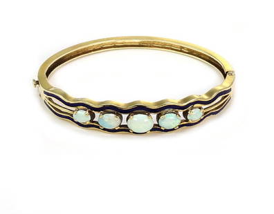 Vintage Opal 14k Yellow Gold Blue Enamel Hinged Bangle Bracelet: Vintage Opal 14k Yellow Gold Blue Enamel Hinged Bangle Bracelet Discover the elegance of this vintage Opal 14k Yellow Gold Blue Enamel Hinged Bangle Bracelet. Crafted from high-quality 14k yellow gold
