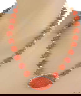 Vintage 14k Gold Carnelian Seed Pearl Oval Pendant Necklace: Vintage 14k Gold Carnelian Seed Pearl Oval Pendant Necklace This exquisite vintage necklace showcases a stunning oval pendant crafted from 14k yellow gold. The pendant features a beautifully carved ca