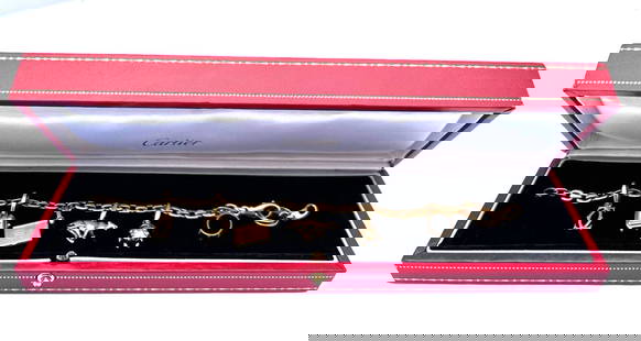 Cartier 18K Yellow Gold Charm Bracelet with 7 Signed Charms and Box: Cartier 18K Yellow Gold Charm Bracelet with 7 Signed Charms and Box This exquisite French Cartier charm bracelet is crafted from 18k yellow gold and features a stunning design with intricate details.
