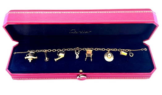 Cartier 18K Yellow Gold Charm Bracelet with 7 Garden Charms and Box: Cartier 18K Yellow Gold Charm Bracelet with 7 Garden Charms and Box This exquisite 1994 French Cartier charm bracelet is crafted from 18k yellow gold and features seven beautifully designed garden cha
