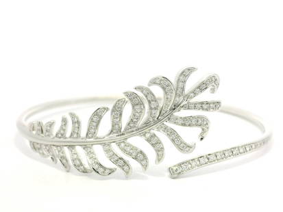 Chanel Plume De White Gold Diamond Feather Bangle Bracelet with Box: Chanel Plume De White Gold Diamond Feather Bangle Bracelet with Box This exquisite Plume De Chanel bangle bracelet showcases a stunning feather design, crafted from luxurious white gold and adorned wi