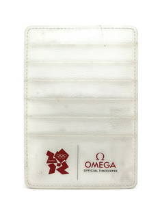 OMEGA London Olympics Manual Card Holder Elegant Accessory: OMEGA London Olympics Manual Card Holder Elegant Accessory Showcase your style and support for the London Olympics with this OMEGA Card Holder. Crafted with a manual design, this elegant accessory is