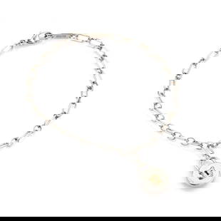 Tiffany & Co. Sterling Silver Padlock Charm Bracelet with 18k Rose Gold Accents: Tiffany & Co. Sterling Silver Padlock Charm Bracelet with 18k Rose Gold Accents This authentic bracelet is from Tiffany & Co. It is crafted from sterling silver with 18k rose gold accent, the chain br