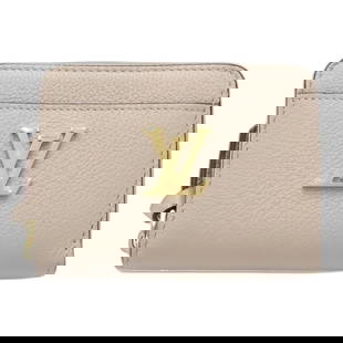 Louis Vuitton M80100 Monogram Zipper Coin Purse Taurillon Leather Grayish: Louis Vuitton M80100 Monogram Zipper Coin Purse Taurillon Leather Grayish This stylish Louis Vuitton Coin Purse is crafted from luxurious Taurillon leather in a sophisticated grayish tone. The purse f