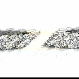 Platinum Eternity Ring 7.26 Ct Diamonds 14 Stones H-I VS1-VS2: Platinum Eternity Ring 7.26 Ct Diamonds 14 Stones H-I VS1-VS2 This exquisite Platinum Eternity Ring showcases 14 dazzling diamonds, totaling 7.26 ct. Crafted from high-quality platinum, this ring weig