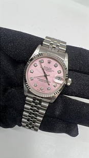 Rolex Datejust Ladies 31mm AM Ice Pink Diamond Dial Jubilee Ref 68274: Rolex Datejust Ladies 31mm AM Ice Pink Diamond Dial Jubilee Ref 68274 This exquisite Rolex Datejust features a stunning AM Ice Pink Diamond dial, elegantly complemented by a fluted bezel and a Jubilee