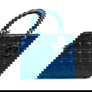 Dior Medium Patent Cannage Lady Dior Blue Leather Bag: Dior Medium Patent Cannage Lady Dior Blue Leather Bag The Medium Patent Cannage Lady Dior bag showcases a stunning quilted patent leather exterior in a vibrant blue color. This elegant bag is designed