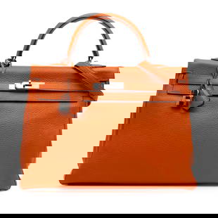 Hermes Togo Kelly II Retourne 35 Orange Leather Bag: Hermes Togo Kelly II Retourne 35 Orange Leather Bag This exquisite Hermes Kelly II Retourne 35 is crafted from luxurious Togo leather in a vibrant Potiron (orange) color. It features a structured desi