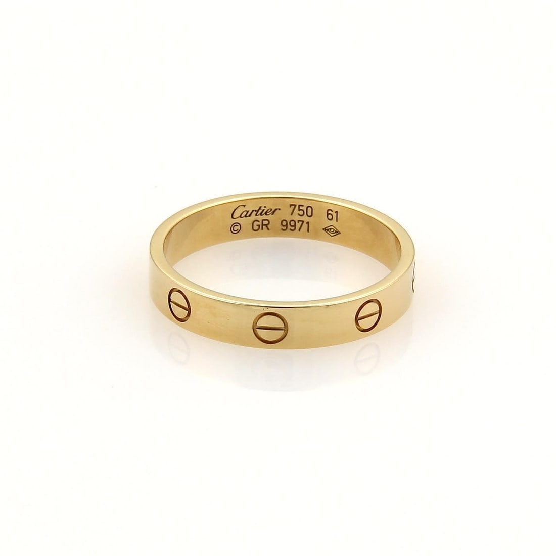 Cartier Mini Love 18k Yellow Gold Band Ring Authentic Size 61 US 9.75: Cartier Mini Love 18k Yellow Gold Band Ring Authentic Size 61 US 9.75 Discover the elegance of this authentic Cartier Mini Love band ring, meticulously crafted from 18k yellow gold with a polished fin