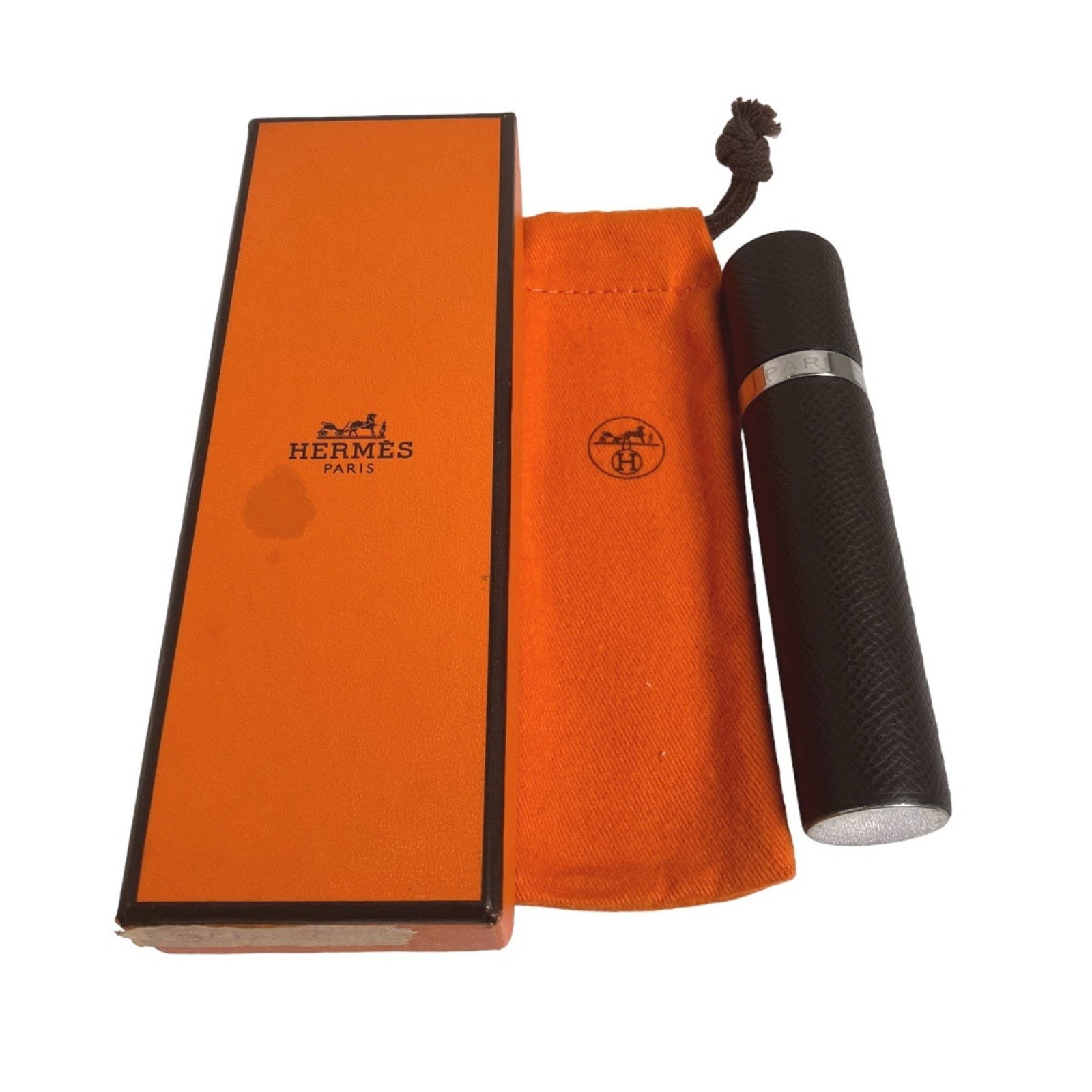 Hermes Brown Leather Portable Perfume Atomizer Case: Hermes Brown Leather Portable Perfume Atomizer Case This Hermes Atomizer Portable Perfume Case is a stylish accessory crafted from high-quality leather in a rich brown color. It features a compact des