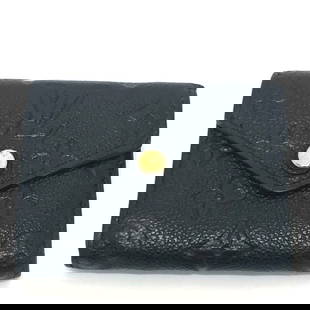 Louis Vuitton Portefeuille Zoe Mini Wallet Tri-fold Monogram Empreinte Black: Louis Vuitton Portefeuille Zoe Mini Wallet Tri-fold Monogram Empreinte Black Elevate your accessory collection with this Louis Vuitton Portefeuille Zoe Wallet, a stylish mini tri-fold wallet designed