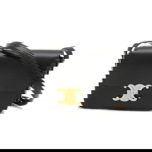 Celine Triomphe Black Calfskin Shoulder Bag with Gold Hardware: Celine Triomphe Black Calfskin Shoulder Bag with Gold Hardware Introducing the Celine Triomphe Shoulder Bag, a stunning accessory crafted from luxurious black calfskin leather. This elegant shoulder b