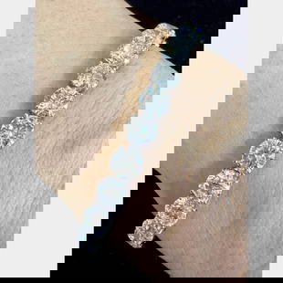 18K White Gold 27 Ct GIA Certified Diamond Tennis Bracelet: 18K White Gold 27 Ct GIA Certified Diamond Tennis Bracelet This exquisite 18K diamond tennis bracelet showcases a stunning array of 27 GIA certified diamonds, totaling an impressive weight of 27.21 Ct