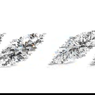 14K White Gold 5.43 Ct Diamond Studs with H-I Color: 14K White Gold 5.43 Ct Diamond Studs with H-I Color Elevate your style with these exquisite 14K White Gold Diamond Stud Earrings. Featuring two stunning diamonds, one weighing 2.85 Ct. and the other 2