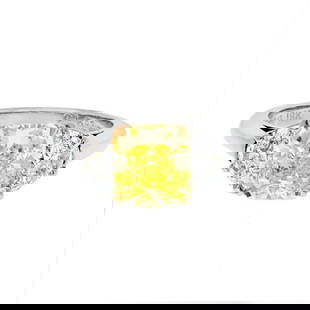 2.16ct GIA Fancy Intense Yellow Cushion Cut Three Stone Ring in Platinum & 18K Gold: 2.16ct GIA Fancy Intense Yellow Cushion Cut Three Stone Ring in Platinum & 18K Gold This exquisite engagement ring showcases a stunning 2.16 carat GIA certified fancy intense yellow radiant cut diamon