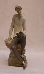 Lladro Boy Studying Torah Porcelain Figurine Hand Painted Spain: Lladro Boy Studying Torah Porcelain Figurine Hand Painted Spain Experience the elegance of this hand-painted porcelain Lladro figurine titled "Boy Studying Torah," crafted in Spain. This exquisite pie