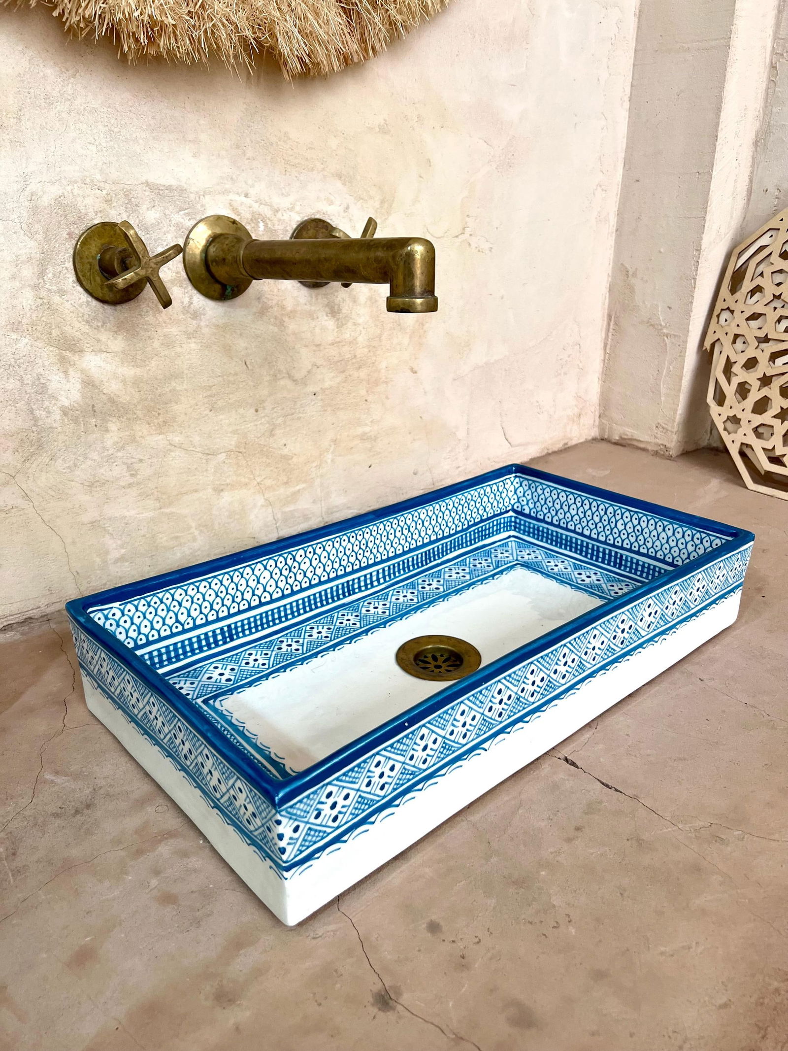 Handmade Moroccan Ceramic Washbasin Sink with Fish Design: Handmade Moroccan Ceramic Washbasin Sink with Fish Design Elevate your bathroom or kitchen decor with this stunning Moroccan rectangular washbasin sink. This exquisite piece is 100% handmade by skille
