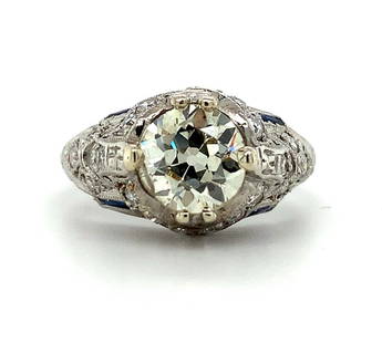 Art Deco Platinum 1.31ct Diamond Ring with Lab-Created Sapphires GIA #J5928: Art Deco Platinum 1.31ct Diamond Ring with Lab-Created Sapphires GIA #J5928 This exquisite Art Deco ring showcases a stunning 1.31ct European cut diamond, certified by GIA with a report number #J5928.