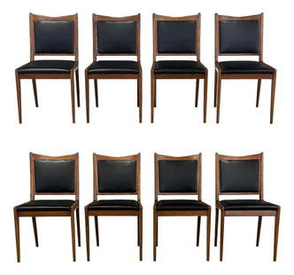 1960s Danish Modern Black Vinyl Dining Chairs Set of 8: 1960s Danish Modern Black Vinyl Dining Chairs Set of 8 Enhance your dining space with this exquisite set of 8 Danish Modern dining chairs from the 1960s. Featuring a stunning oak frame with a rich wal